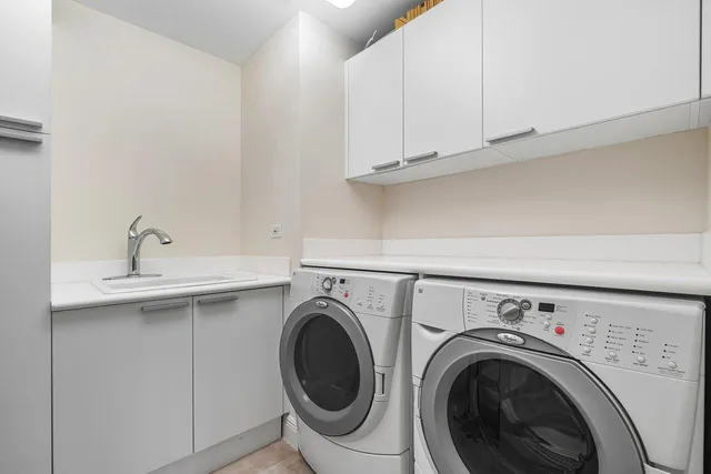 a bedroom with furniture windows and a potted plant