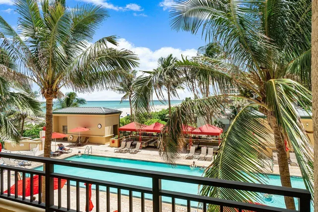 a dining room with furniture and a chandelier