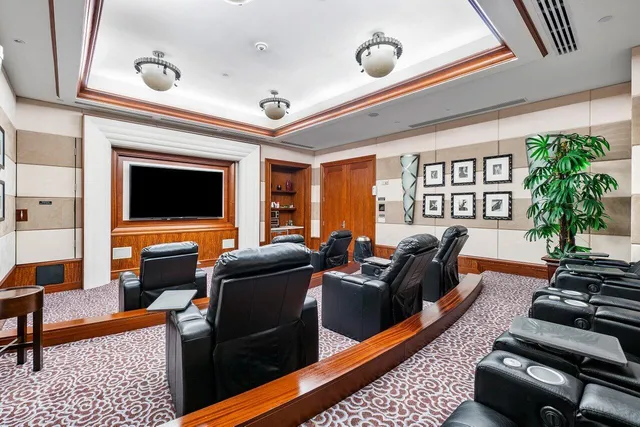 a view of a palm tree next to a yard