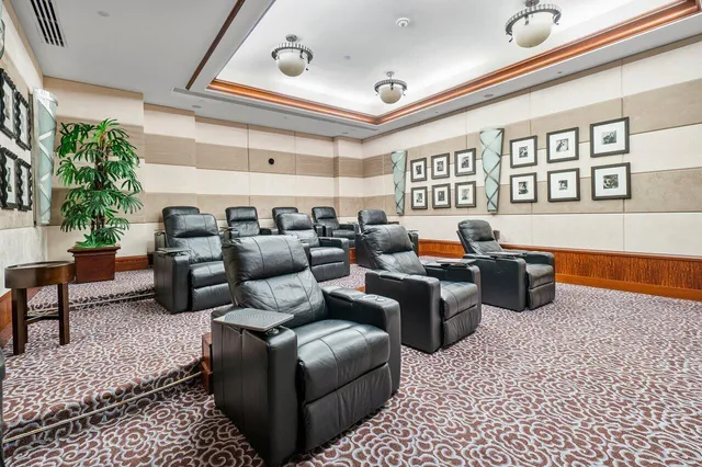 a room with lots of wooden furniture and stainless steel appliances