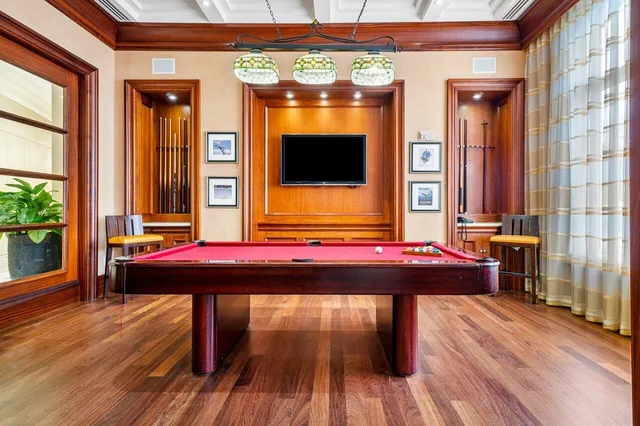 a lobby with furniture and floor to ceiling windows