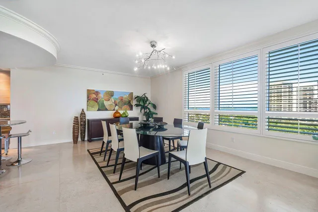 a view of a dining room with furniture window and outside view