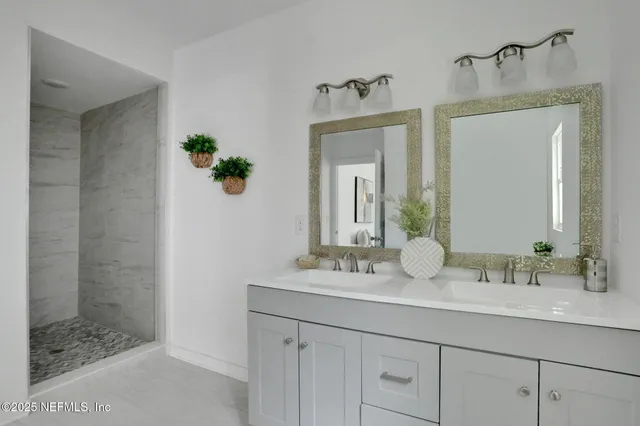a bathroom with a sink a vanity and a mirror