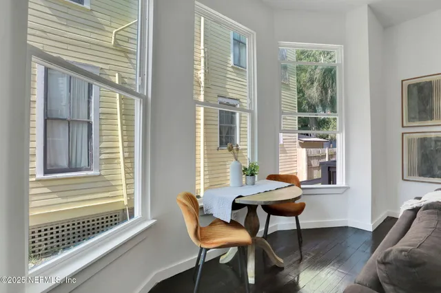 a living room with furniture and windows