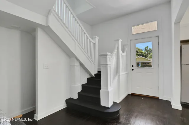 a view of entryway with wooden floor