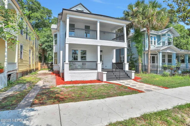 a balcony view with a seating space