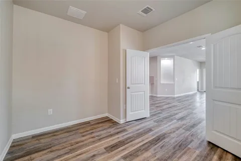 an empty room with windows