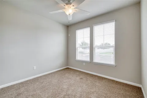 an empty room with closet area