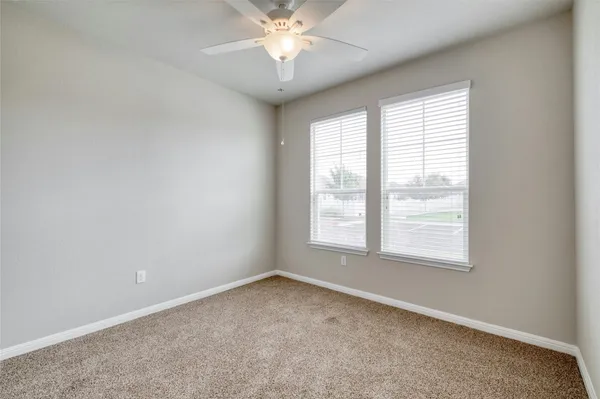 an empty room with closet area