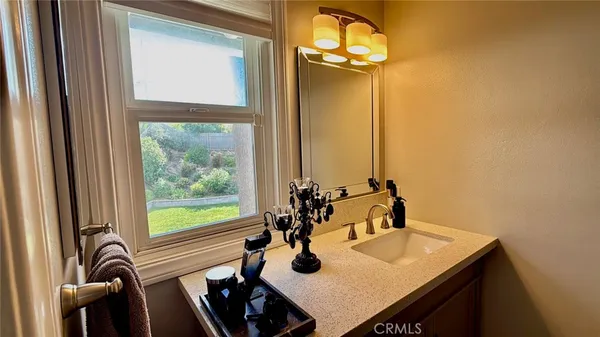 a view of a dining room with furniture and a window