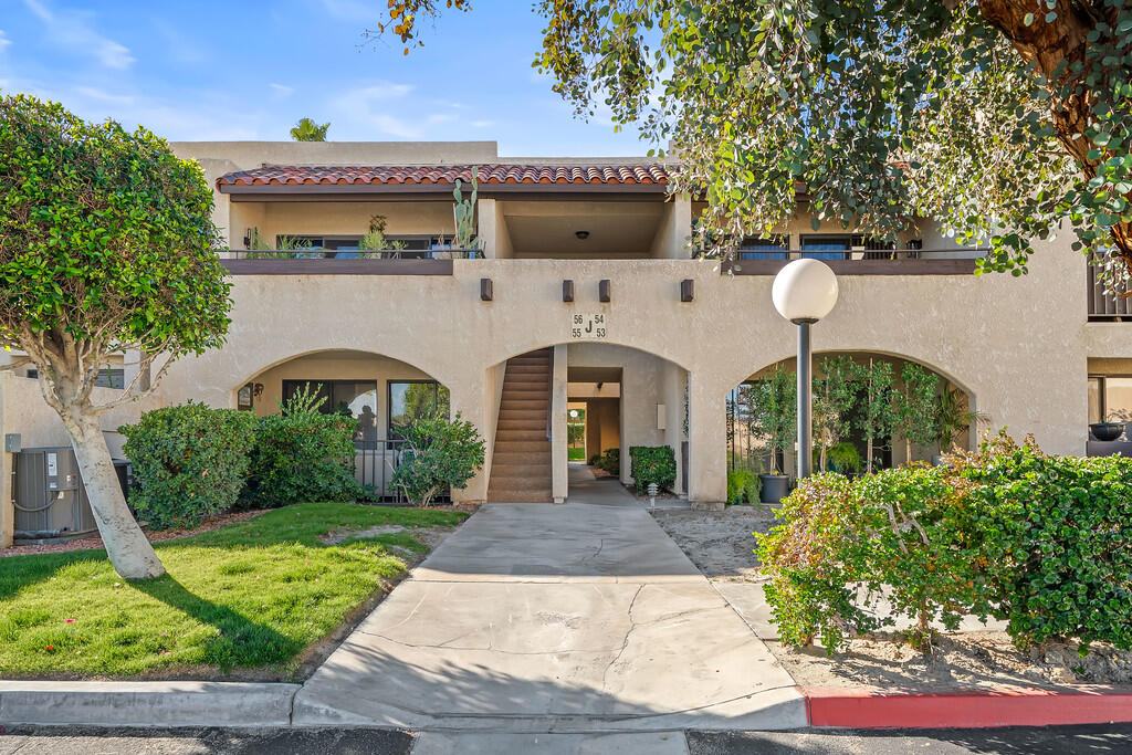 200 East Racquet Club Road, Unit 54 Palm Springs, CA 92262 - Photo 1 of 29 a front view of house with yard