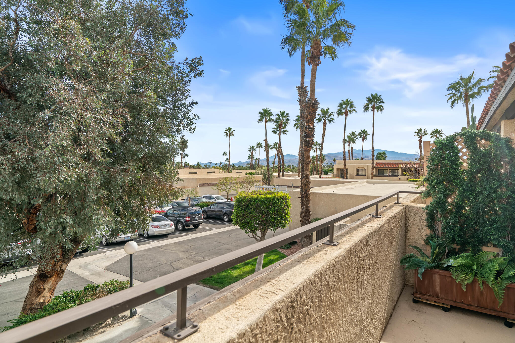 200 East Racquet Club Road, Unit 54 Palm Springs, CA 92262 - Photo 22 of 29 a view of a city skyline from a balcony