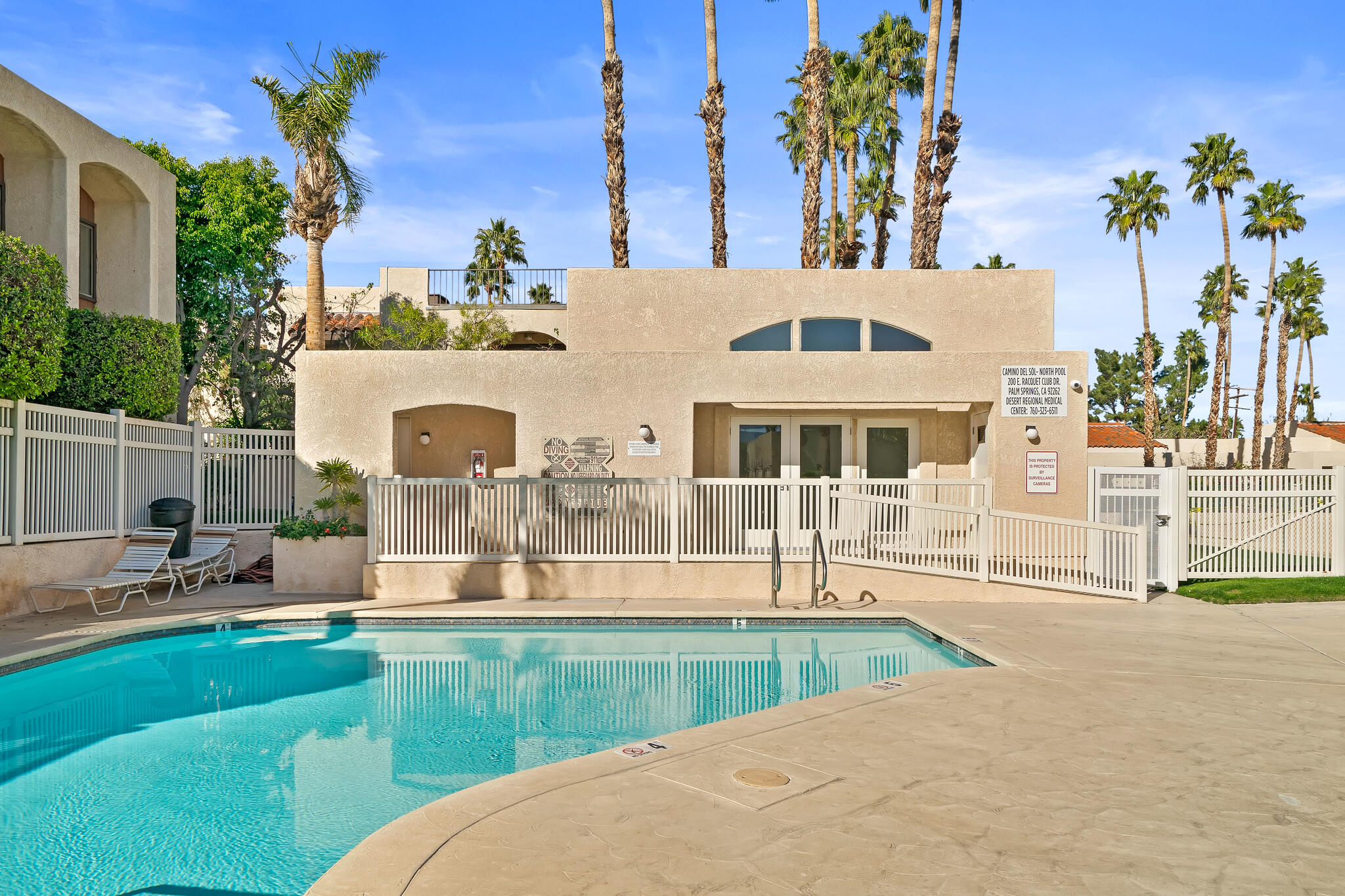 200 East Racquet Club Road, Unit 54 Palm Springs, CA 92262 - Photo 24 of 29 a front view of a house with a yard