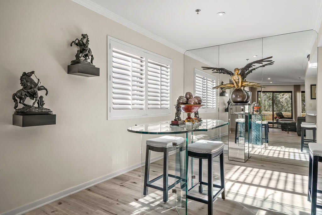 200 East Racquet Club Road, Unit 54 Palm Springs, CA 92262 - Photo 8 of 29 a view of a dining room with furniture window and outside view