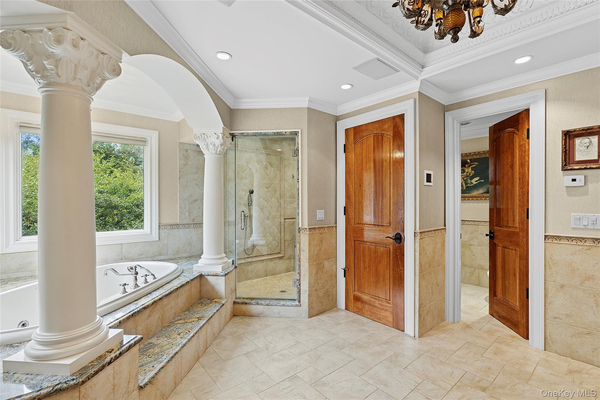 5 Schoolhouse Court Oyster Bay, NY 11771 - Photo 15 of 33 a bathroom with a tub and a shower