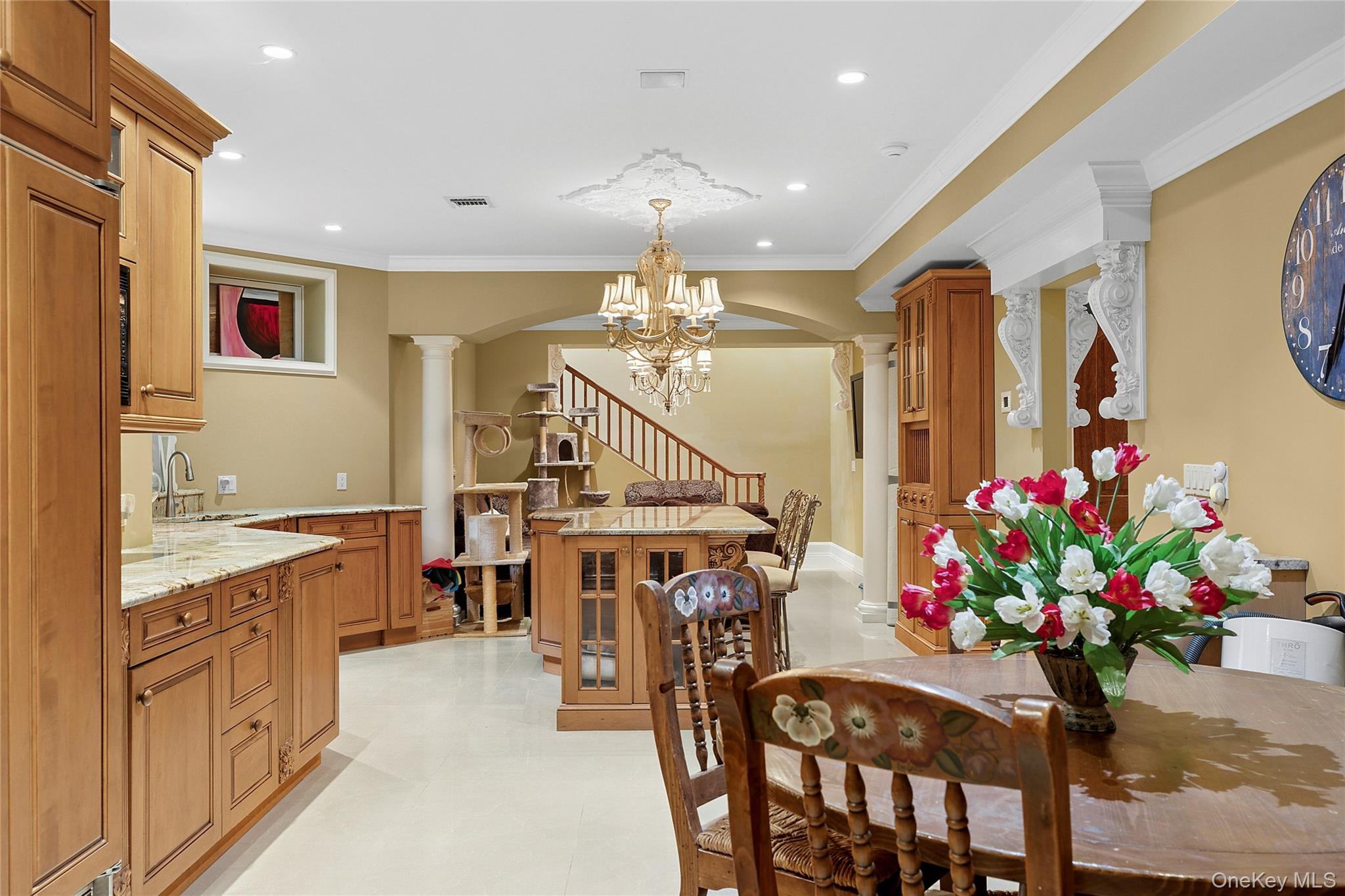 5 Schoolhouse Court Oyster Bay, NY 11771 - Photo 26 of 33 a dining room with furniture and chandelier
