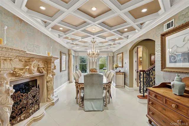 a dining room with furniture a fireplace and wooden floor