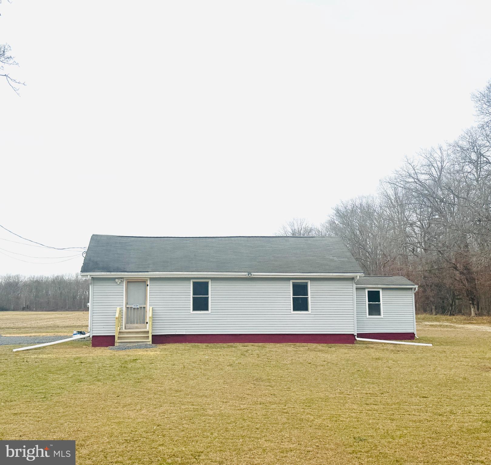 4594 Post Road Vineland, NJ 08360 - Photo 1 of 7 a front view of a house with a yard
