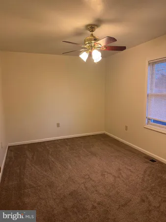 a view of a room with a fan
