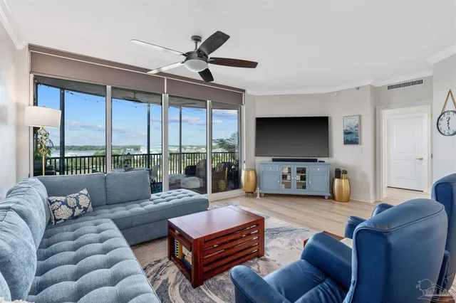 a bedroom with a large bed and a large window