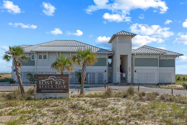 a view of a swimming pool with an outdoor space and seating area