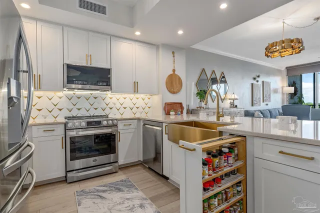 a view of a patio with a table chairs and a balcony