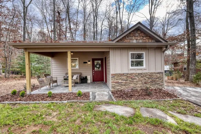 a front view of a house with garden