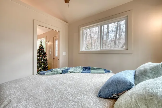 a bathroom with a granite countertop sink toilet a mirror and shower