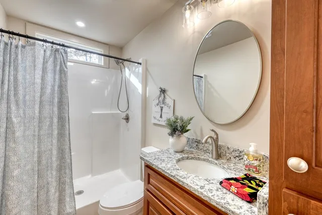 a view of a room with wooden floor and wall painting