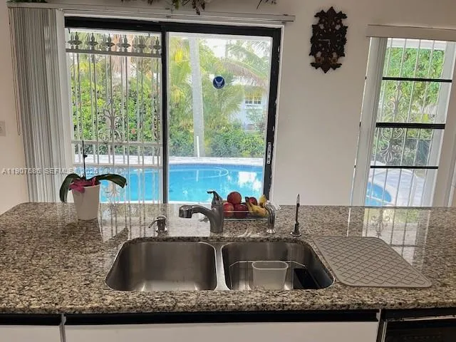 a kitchen with stainless steel appliances a stove a microwave and a refrigerator