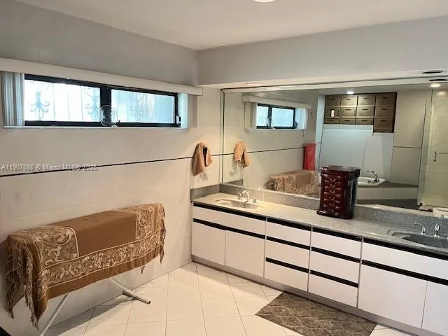 a bathroom with a bathtub and shower