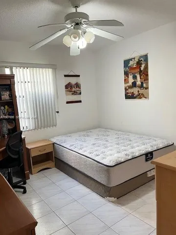 a bathroom with a sink toilet and a mirror