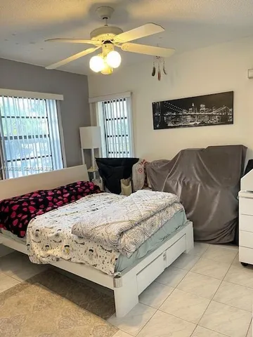 a bedroom with a bed and a mirror