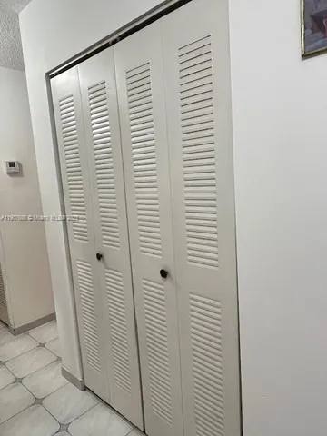 a bathroom with a glass door shower