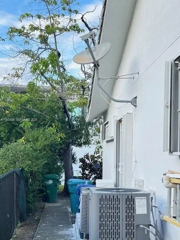 a view of a house with outdoor space and sitting area