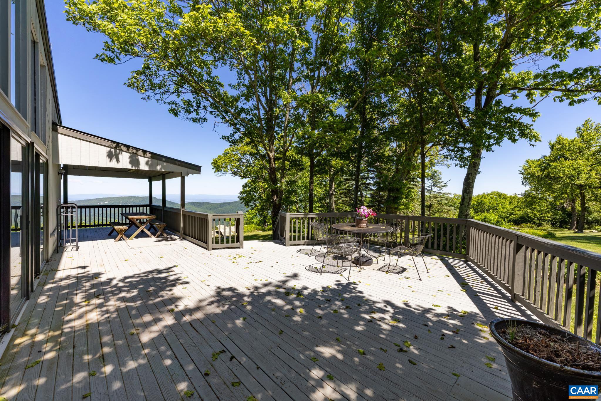 7098 Bucks Elbow Mountain Road Crozet, VA 22932 - Photo 45 of 57 a view of a chairs and tables in the patio