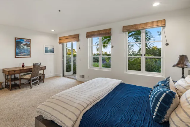 a bed room with a bed and a chair