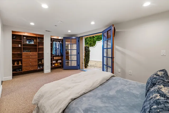a bedroom with a bed and a walk in closet