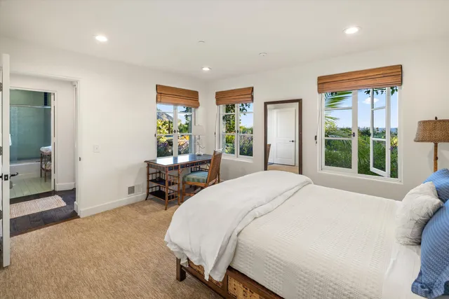 a bed room with a bed and a chair