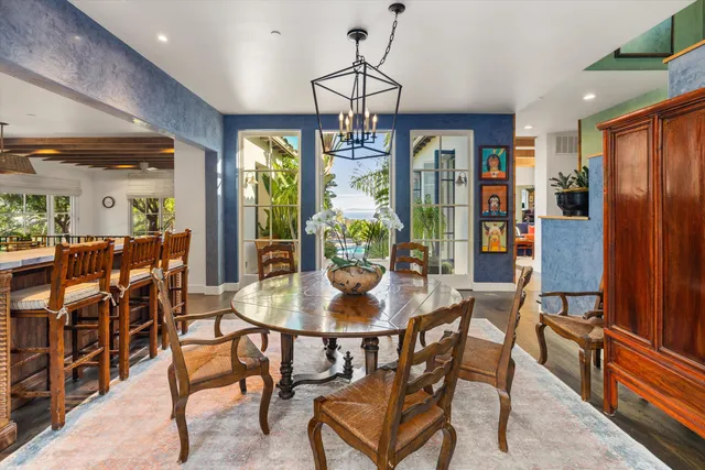 a view of a dining room with furniture window and outside view