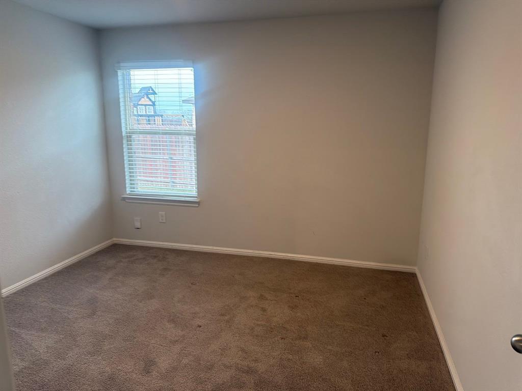 721 Durango Lane Cleburne, TX 76033 - Photo 18 of 25 an empty room with a window