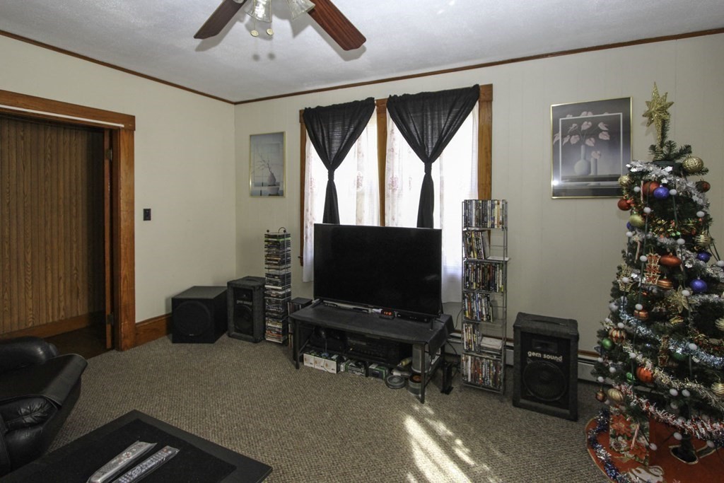 68 Bemis Road Fitchburg, MA 01420 - Photo 2 of 21 a living room with furniture and a flat screen tv