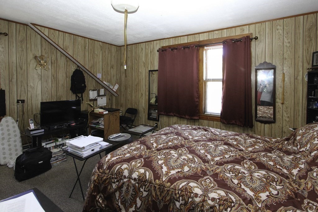 68 Bemis Road Fitchburg, MA 01420 - Photo 6 of 21 a bedroom with bed and a chandelier