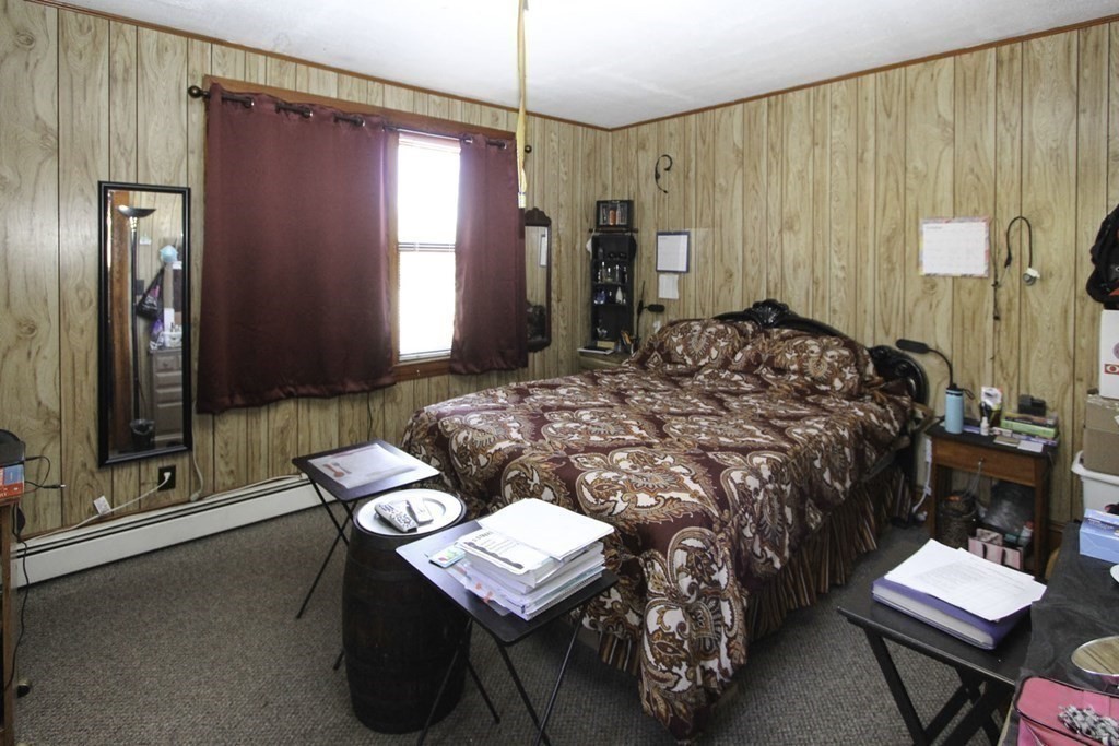 68 Bemis Road Fitchburg, MA 01420 - Photo 7 of 21 a bedroom with a bed and a dresser with mirror