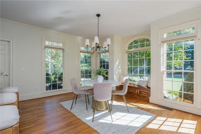 a bathroom with a granite countertop sink mirror vanity and toilet