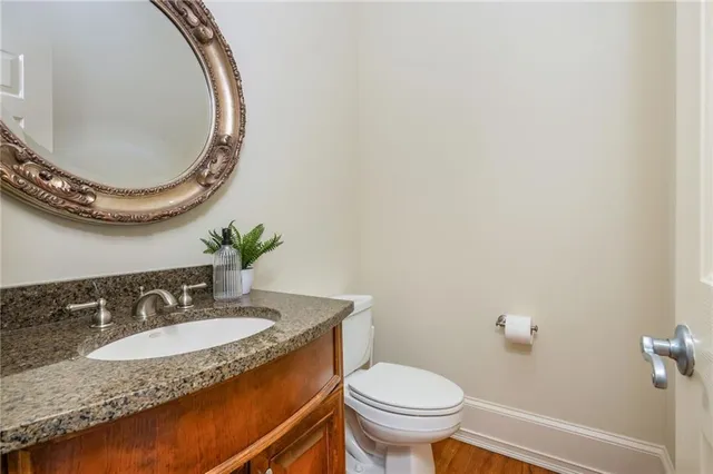 a front view of a house with yard and green space