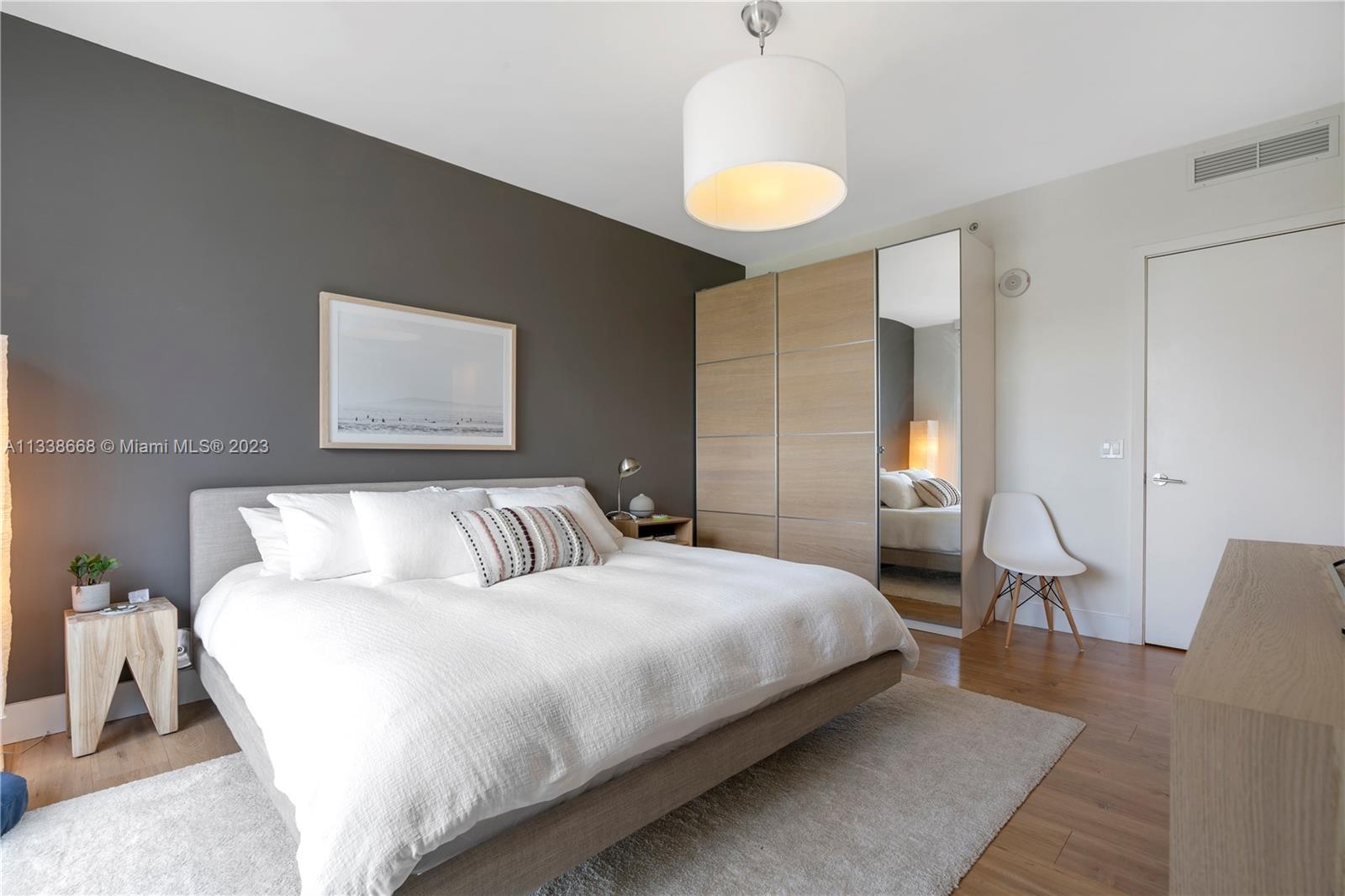 201 Southwest 17th Road, Unit 501 Miami, FL 33129 - Photo 15 of 20 a bedroom with a bed and a chandelier