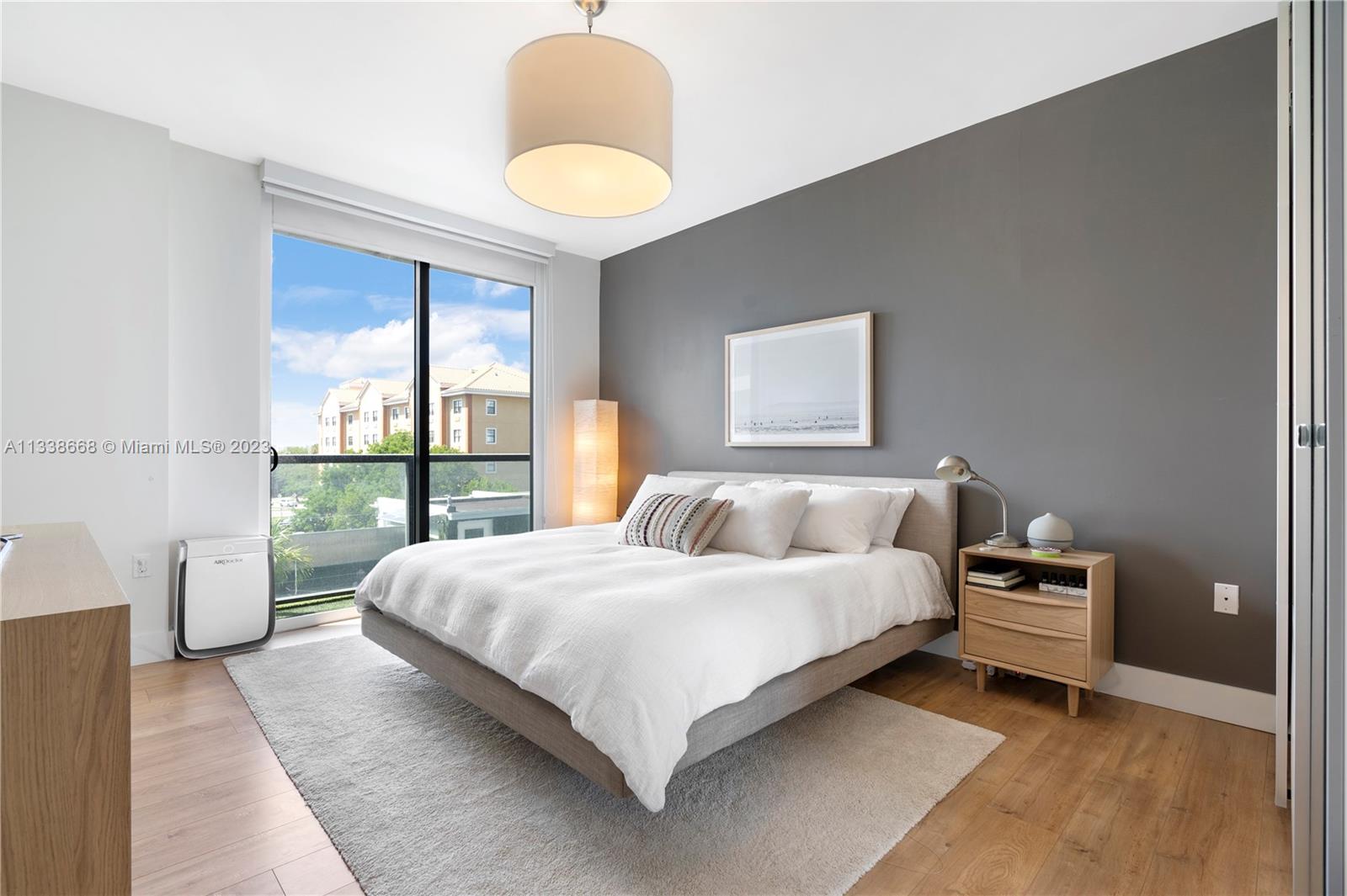 201 Southwest 17th Road, Unit 501 Miami, FL 33129 - Photo 4 of 20 a bedroom with a large bed and a large window