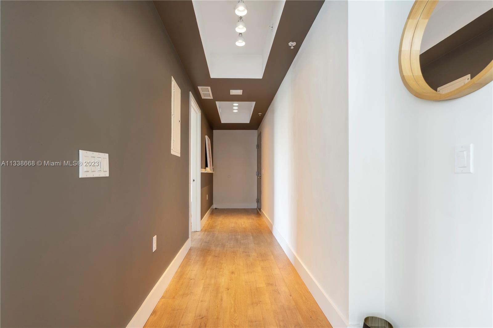 201 Southwest 17th Road, Unit 501 Miami, FL 33129 - Photo 6 of 20 a view of a hallway with wooden floor