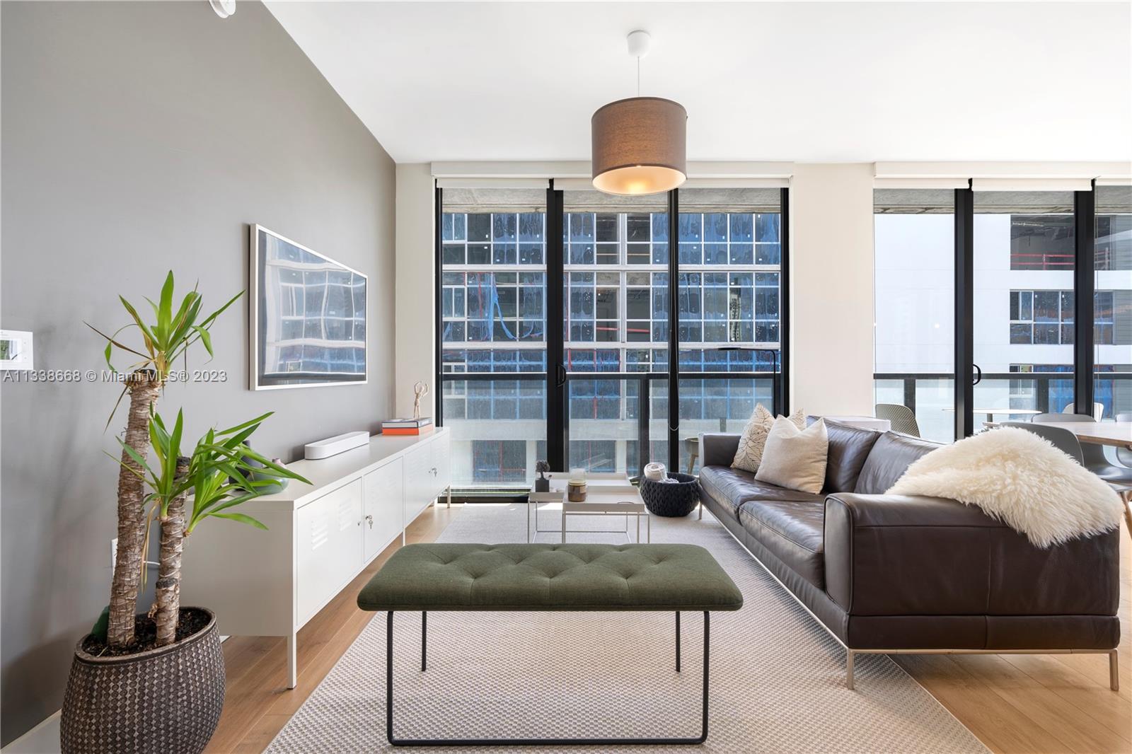 201 Southwest 17th Road, Unit 501 Miami, FL 33129 - Photo 8 of 20 a living room with furniture and a potted plant